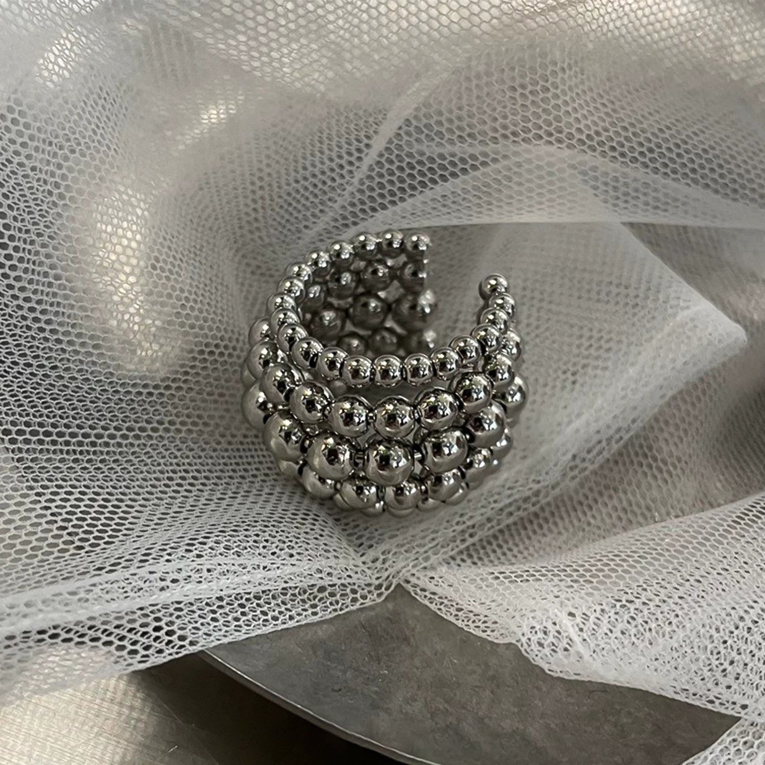 Multi-layered round bead open ring