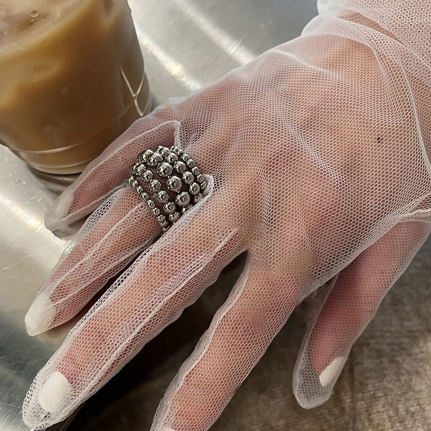 Multi-layered round bead open ring